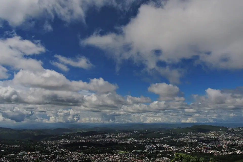 Big white clouds over the sprawl of Shillong city, seen from the viewpoint on Shillong Peak