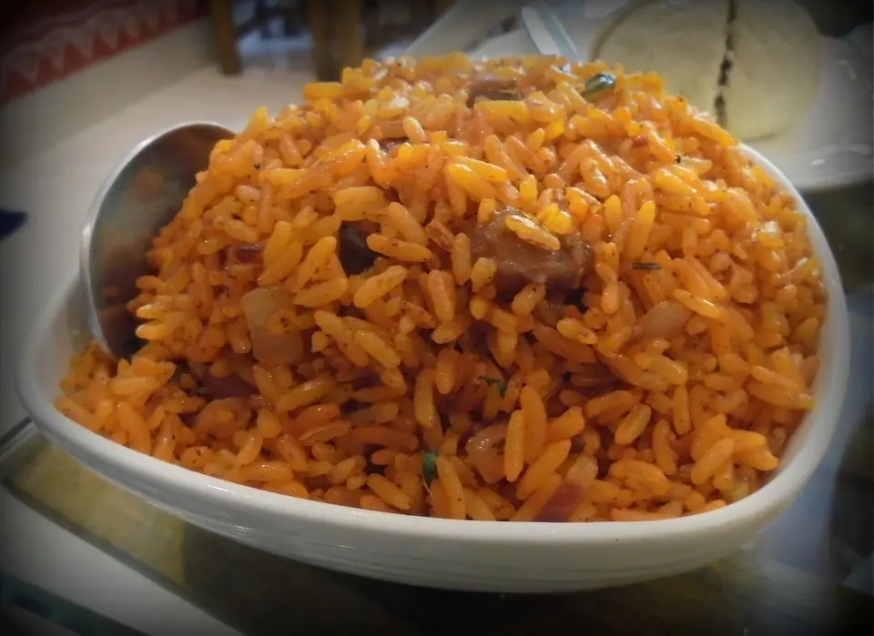 A bowl of jadoh, the Khasi red rice cooked with pork or mutton, Meghalaya