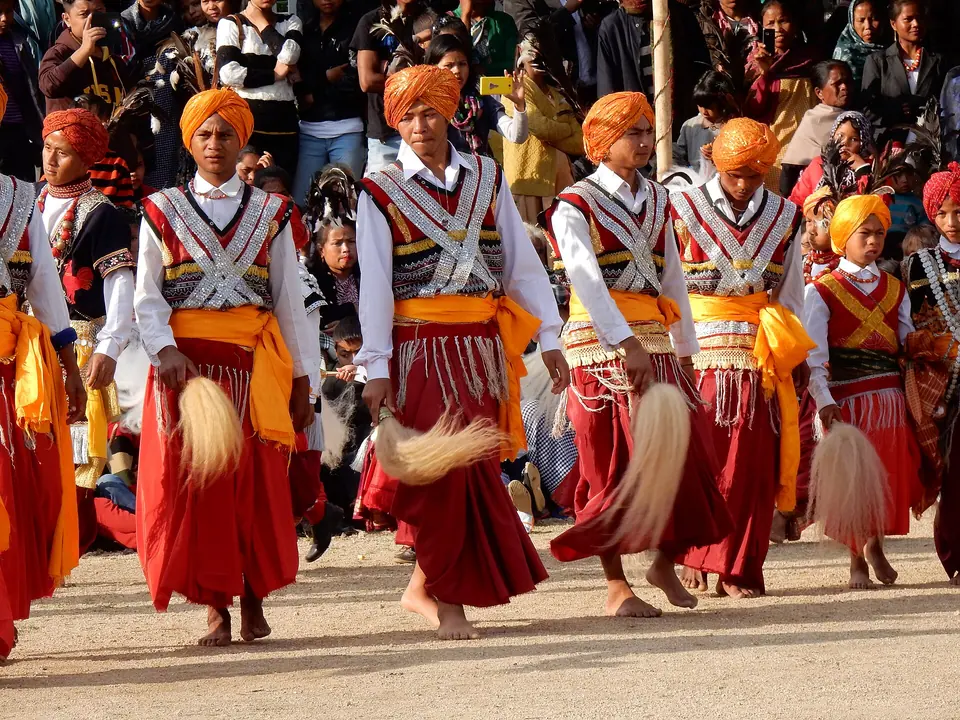 Khasi men in plumed turbans with yak-tail whisks dancing at the Nongkrem festival, Smit