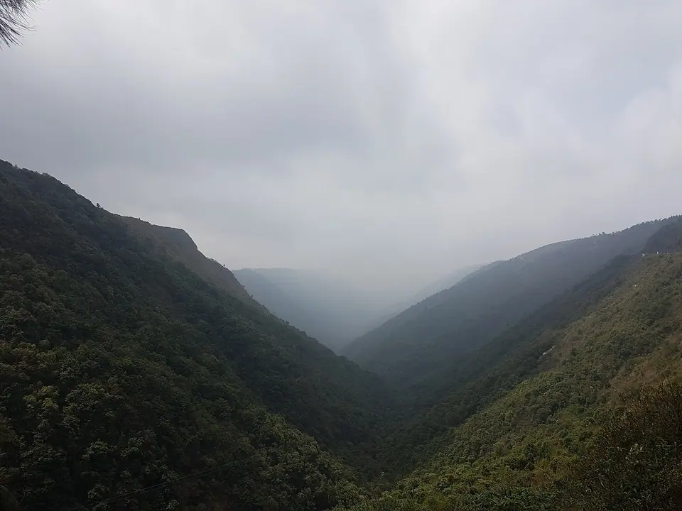 Rain cloud filling the deep forested Mawkdok Dympep valley on the Sohra road